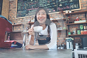 Small business: Happy owner of a cafe. Young startup owner small