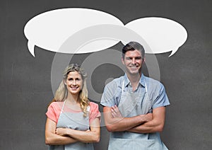 Small business owner couple with speech bubbles standing against grey background