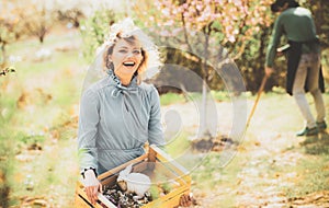 Small business owner selling organic fruits and vegetables. Gardening in spring - happy couple harvesting and having