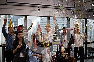 Small business persons staff happy new year party in the offices.