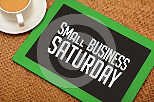 Small Business Saturday design on chalkboard with tea cup