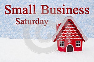 Small Business Saturday message with winter store and snow photo