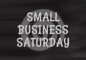 Small Business Saturday written in white chalk on a black chalkboard