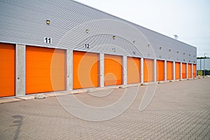 Small business units with orange roller doors