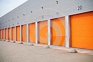 Small business units with orange roller doors