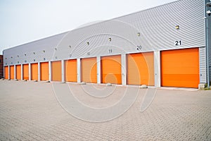 Small business units with orange roller doors