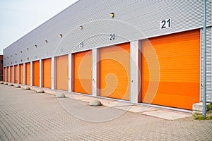 Small business units with orange roller doors