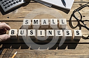 Small Business words on blocks SME and entrepreneur startup businesses concept