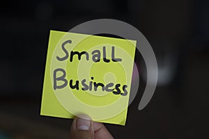 Small Business wrote on a card at the office Hold The Hand, Small Business written on a card