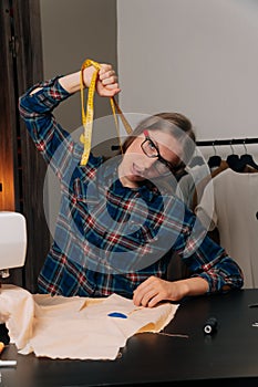 Small businesses are no longer working . The seamstress strangles himself with a centimeter ribbon