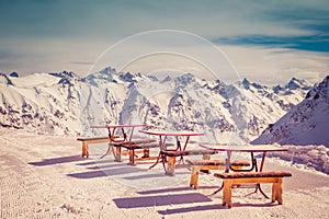 Small cafe for skiers and snowboarders on the top of the mountains of the Caucasus, Dombai on a winter sunny day. Toned image