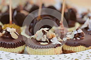 Small cakes with chocolate and coconut flakes