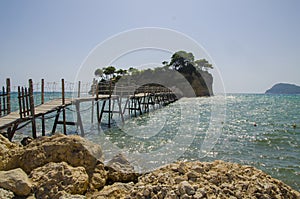 The small Cameo Island and the wooden bridge to Agios Sostis