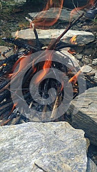 Small camp fire in the nature in Himalayas