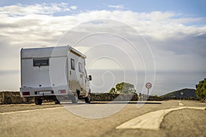 Small camper van parked on the side of the road in Arrabida Natural Park, Portugal photo