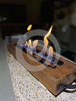 Small campfire in portable fireplace