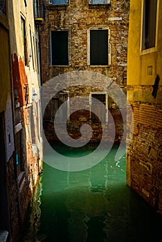 Small Canal among houses in Venice