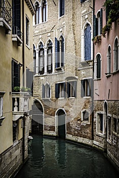 Small Canal among houses in Venice