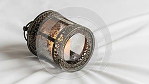 Within by a small candle casting a warm glow and highlighting