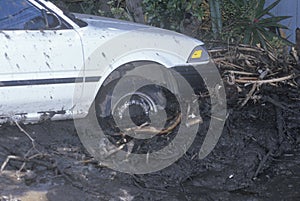 A small car stuck after the mudslides