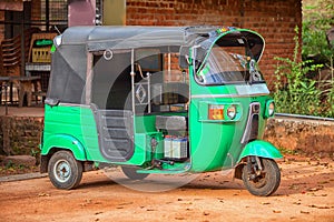 Small car with three wheels. Asian taxi tuk-tuk