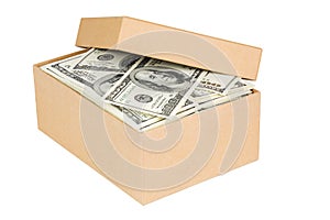 A small cardboard box with dollar banknotes isolated on white background