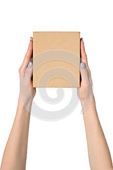 Small cardboard box in female hands. Top view. Isolate