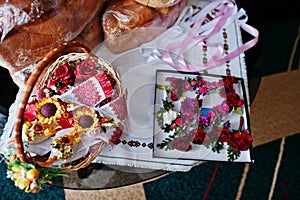 Small carnation flowers buttonhole with traditional loaf.