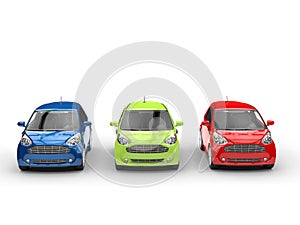 Small cars in a row - Red, Green and Blue - front view