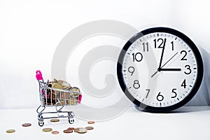 Small cart with coins on white background.