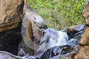 Small cascade with clear and limpid waters photo