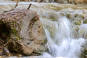 Small cascades of waterfalls on a mountain stream in the spring. Parod River. Israel