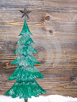 Small Ceramic Christmas Tree in Front of Wooden Background