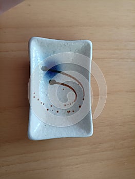 small ceramic plate for dipping your sushi in shoyu soy sauce