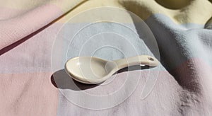 A small ceramic spoon rests on
