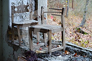 Small chairs by window without glass in kindergarten, Pripyat, Chernobyl NPP alienat