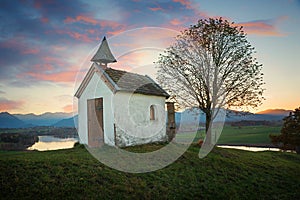 Small chapel on the hill, dreamy sunset scenery upper bavaria