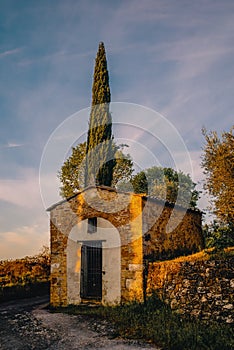 A small chapel on the hills of the Val d\'Orcia early in the morning