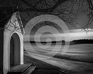 A small chapel with panoramic views, flooded with light and shadows