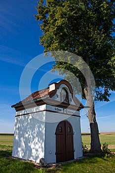 Small chapel roadside shrine next to the road.