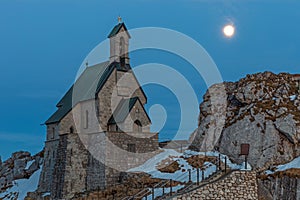 Small chapel on the summit of Wendelstein mountain at full moon