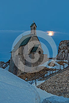 Small chapel on the summit of Wendelstein mountain at full moon