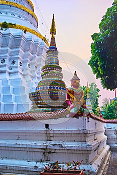 The small chedi and Yaksha statue, Wat Ket Karam, Chiang Mai, Thailand