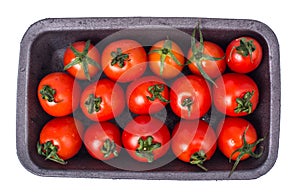 Small cherry tomatoes in black plastic mold