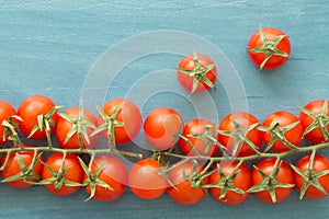 Small cherry tomatoes on a blue wooden