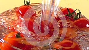 Small cherry tomatoes washed in a glass bowl