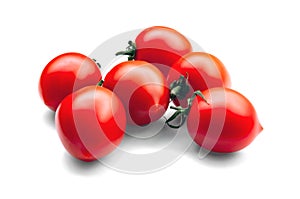 Small cherry tomatoes on white background close up