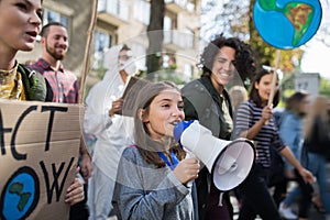 Small child with amplifier on global strike for climate change.