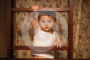 Small child boldly climbing the stairs photo