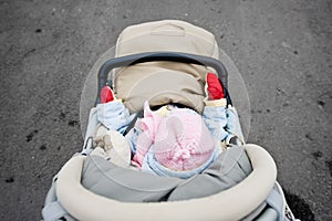 Small child in carriage from above